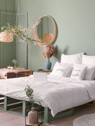 Pastel green and muted tone bedroom design 