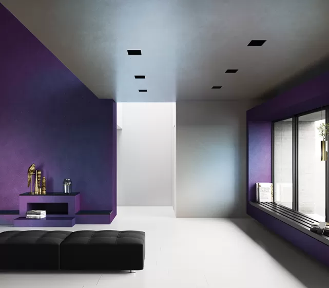 Large living room with purple walls  